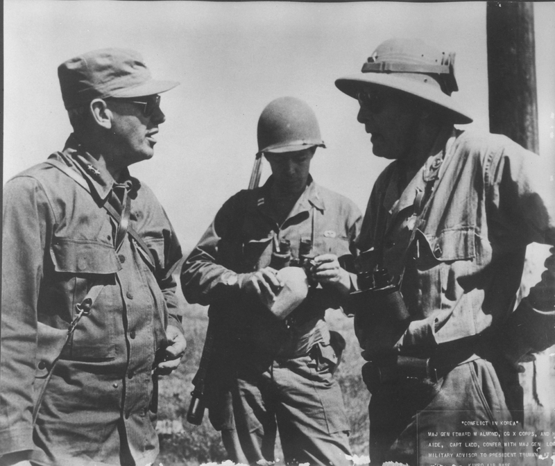 Major General Edward M. Almond and his aide confer with General Frank E. Lowe during Korean War