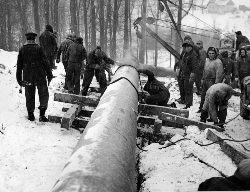 Bell hole welders working on pipeline Harry S. Truman