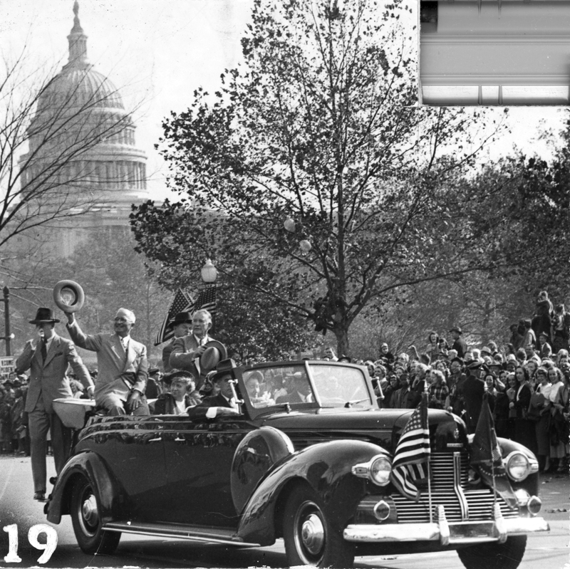 President Harry S. Truman in motorcade in Washington, D. C., passing ...