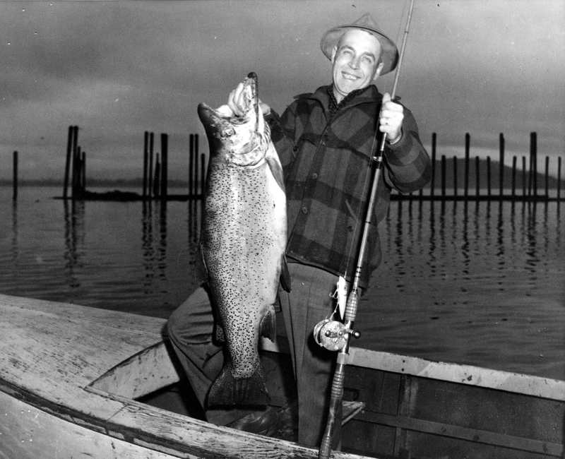 Man Holding Fish In Boat On Sandpoint Idaho Lake Harry S Truman