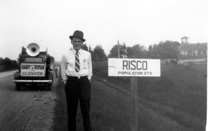Bentley Morrow poses at Risco, Missouri sign Harry S. Truman