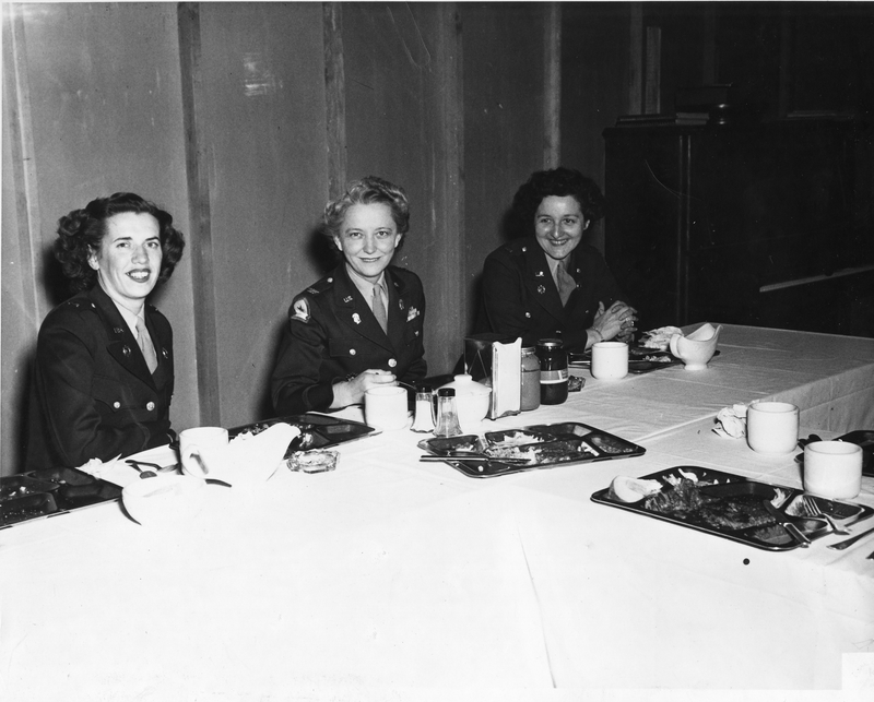 Colonel Westray B. Boyce Dines with Members of the Women's Army Corps