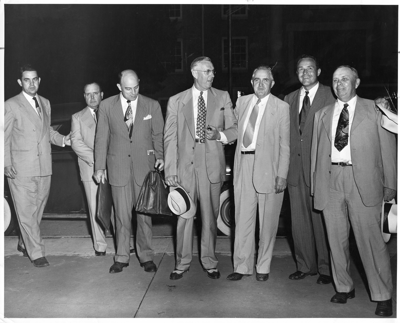 John R. Steelman Poses for a Photograph with a Group of Men Harry S. Truman