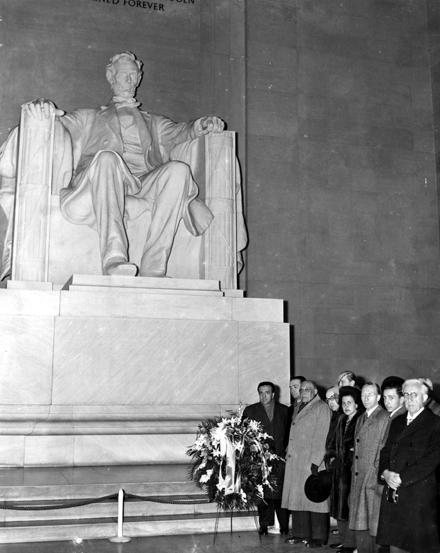 Dignitaries in front of the statue of Lincoln in the Lincoln Memorial