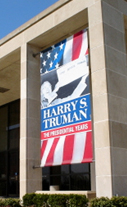 Harry Truman banner haning in building window